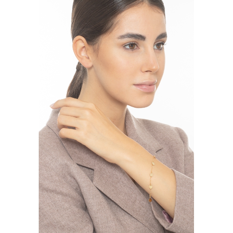 Bracelet en or jaune 18k orné de sept charms ronds