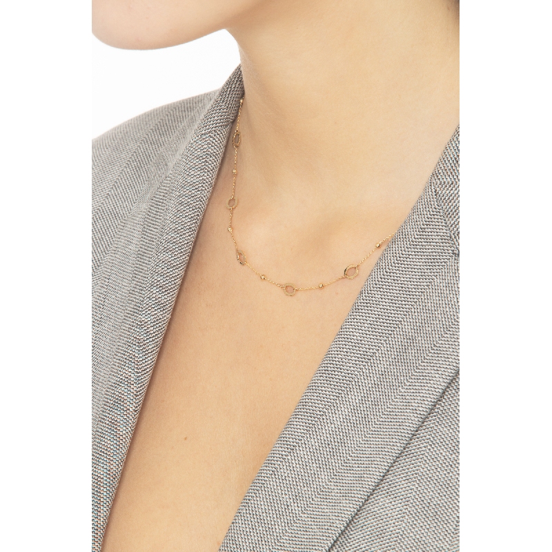 Collier en or jaune 18k avec perles et anneaux Collier en or jaune 18k avec perles et anneaux