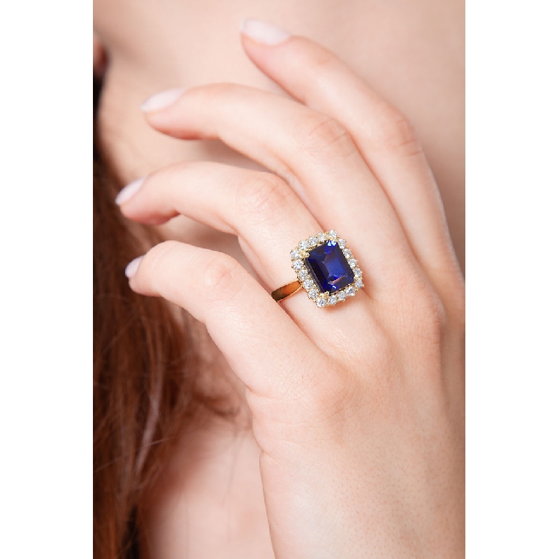 Bague halo en or jaune 18k avec saphir bleu et diamants