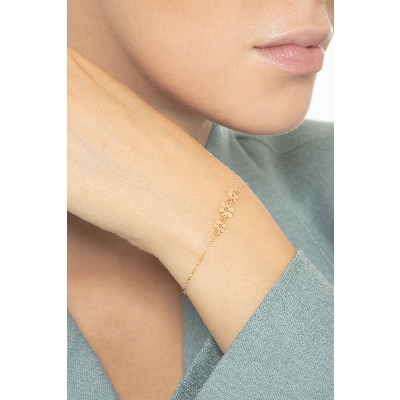 Bracelet en or jaune 18k trois fleurs 