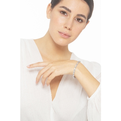 Bracelet tennis griffé en or blanc 18k avec diamants