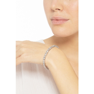 Bracelet tennis griffé en or blanc 18k avec diamants