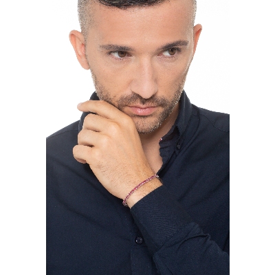 Bracelet tennis griffé en or blanc 18k serti de rubis 