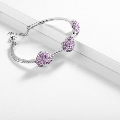 Bracelet en or blanc et diamants avec saphirs roses