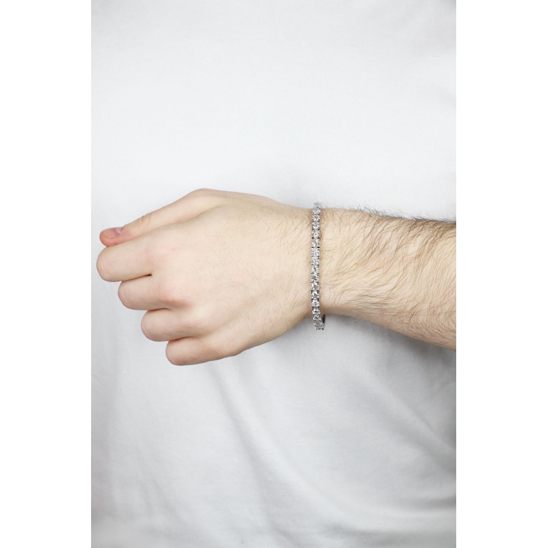 Bracelet tennis griffé en or blanc 18k avec diamants Bracelet tennis griffé en or blanc 18k avec diamants