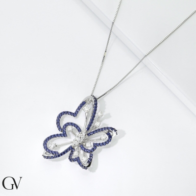 Collier design avec pendentif papillon en or blanc 18k orné de saphirs bleus