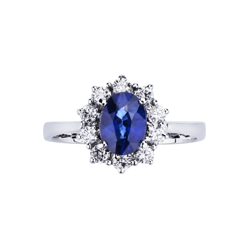 Bague halo en or blanc 18k avec saphir bleu ovale et diamants Bague halo en or blanc 18k avec saphir bleu ovale et diamants