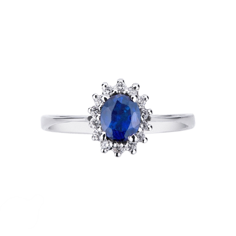 Bague en or blanc avec saphir bleu et halo de diamants Bague en or blanc avec saphir bleu et halo de diamants