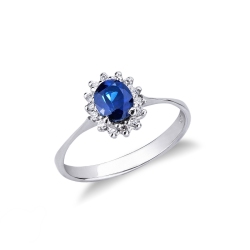 Bague en or blanc avec saphir bleu et halo de diamants