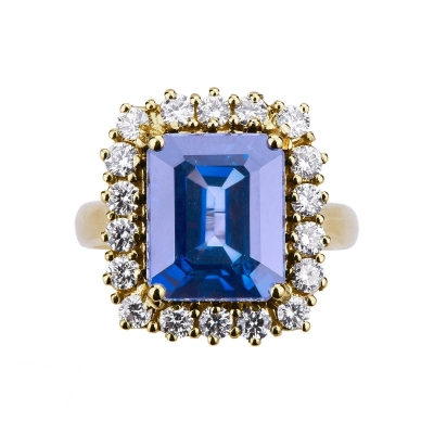 Bague halo en or jaune 18k avec saphir bleu et diamants