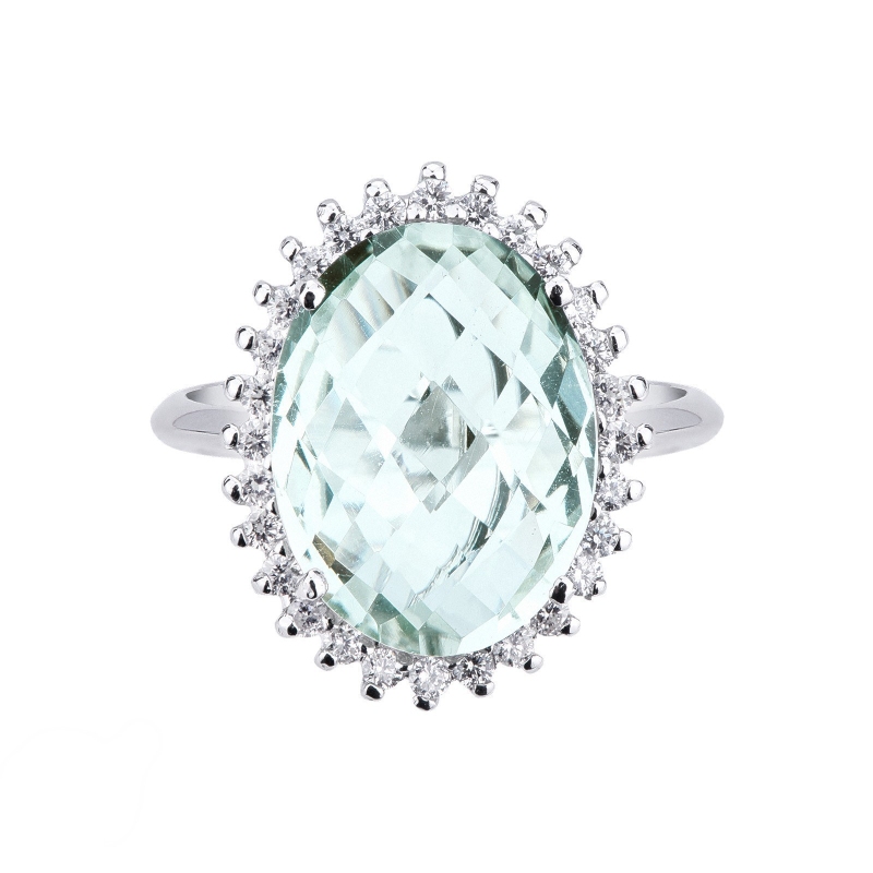 Bague halo en or blanc 18k avec topaze bleue et diamants Bague halo en or blanc 18k avec topaze bleue et diamants