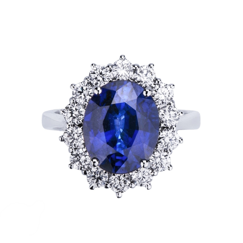 Bague halo en or blanc 18 carats avec diamants et saphir bleu central Bague halo en or blanc 18 carats avec diamants et saphir bleu central