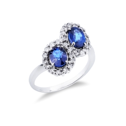 Anillo de oro blanco 18 quilates con doble halo y zafiros azules