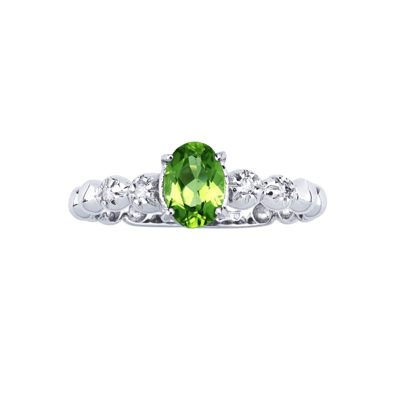 Bague en or blanc 18 carats avec un péridot et 2 diamants Bague en or blanc 18 carats avec un péridot et 2 diamants