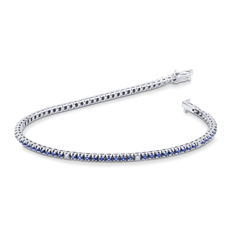 Bracelet tennis griffes en or blanc 18K avec saphirs bleus et diamants Bracelet tennis griffes en or blanc 18K avec saphirs bleus et diamants
