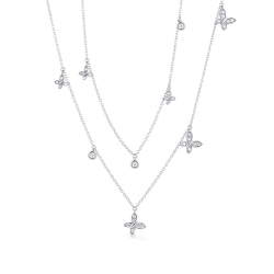Collier double rang avec pendentifs et papillon en diamants or 750