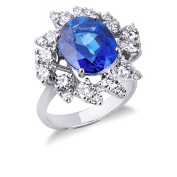 Bague halo en or blanc 18k sertie d’un saphir bleu taille ovale et diamants