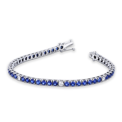 Bracelet tennis à griffes en or blanc 18 carats serti de saphirs bleus