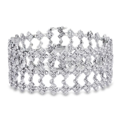 Bracelet en or blanc 18k avec maillons a trois chatons et diamants