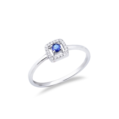 Bague en or blanc 18 carats avec saphir bleu central et contour en diamants