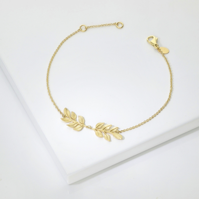 Bracelet en or jaune 18k avec deux feuilles brillantes et satinées Bracelet en or jaune 18k avec deux feuilles brillantes et satinées