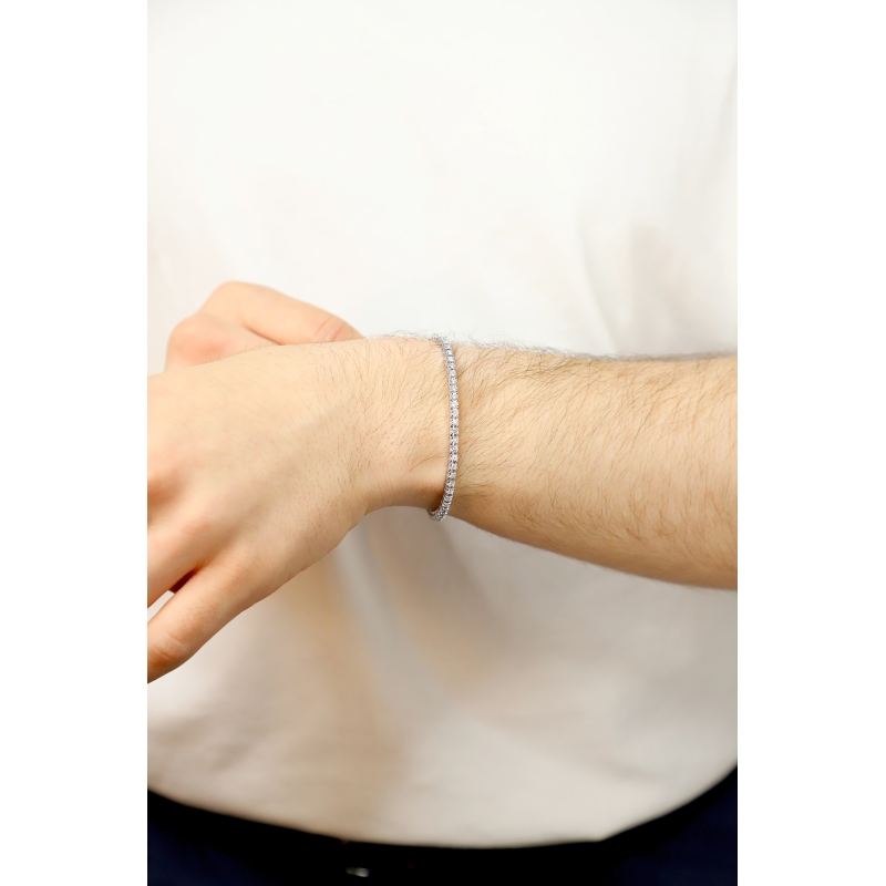 Bracelet tennis griffe elastique en or blanc 750 avec diamants