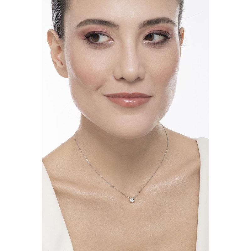 Pendentif Solitaire Diamant serti clos 0.10 ct et or blanc 18k  Pendentif Solitaire Diamant serti clos 0.10 ct et or blanc 18k