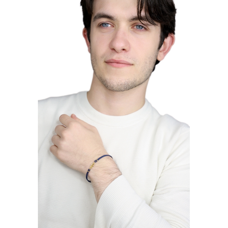 Bracelet en tissu bleu avec nœud en or jaune 18k Bracelet en tissu bleu avec nœud en or jaune 18k