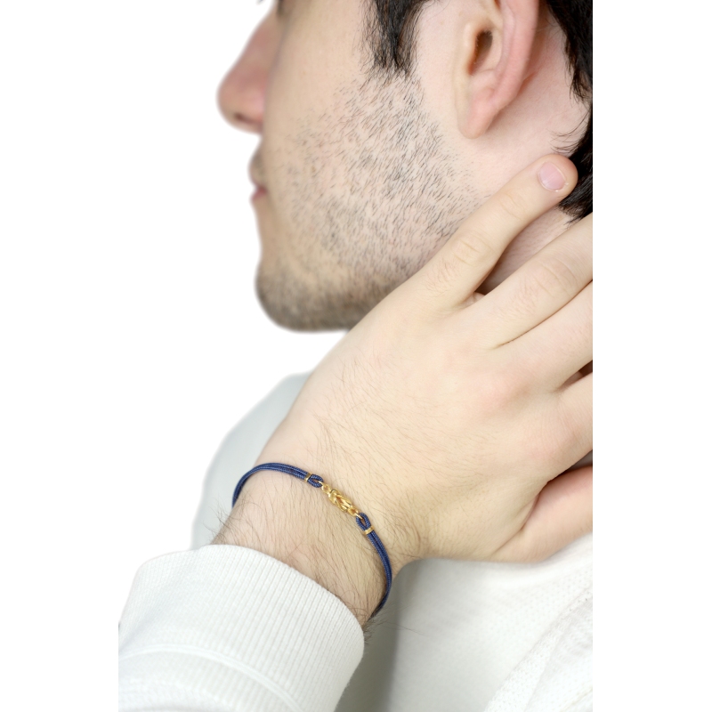 Bracelet en tissu bleu avec nœud en or jaune 18k Bracelet en tissu bleu avec nœud en or jaune 18k