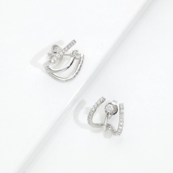 Boucles d'oreilles courbe or blanc 750 et diamants