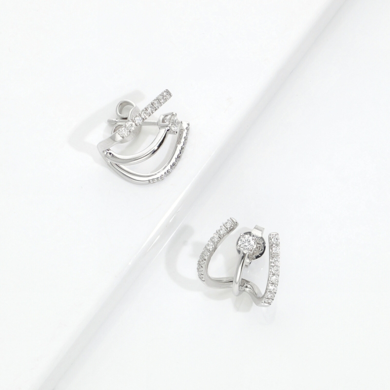 Boucles d'oreilles courbe or blanc 750 et diamants